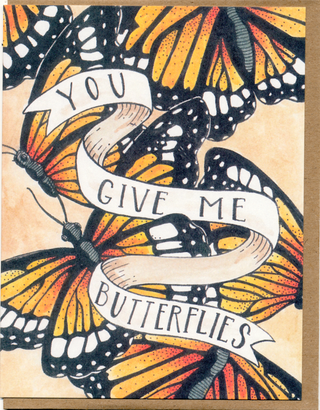You Give Me Butterflies Card - Holt x Palm -  €¢ Greeting Card Illustrated by Cayla Mattea Zeek €¢ Created in Lafayette, Louisiana USA €¢ A2 Card Measures 4.25" x 5.5" Folded €¢ Blank Inside €¢ Printed on Post Consumer Waste Recycled Heavy Card-Stock Paper €¢ Recycled Kraft Brown Envelope €¢ Eco Clear Plant-Based PLA (Polylactic Acid) Sleeve, Commercially Compostable