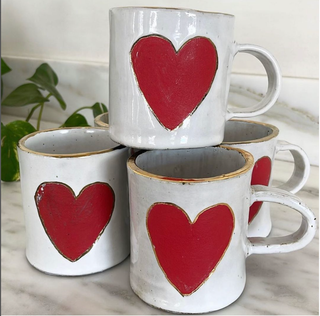 Handmade, Heart mug with 24k goldluster - Holt x Palm -  Experience the beauty and luxury of our Handmade Heart mug. This 12oz mug is carefully handcrafted and features a stunning 24k goldluster design. Sip your favorite drink in style and add a touch of elegance to your daily routine. A perfect gift for yourself or a loved one. Wash by hand Contain 22k gold lusters, so it is not suitable for microwaves or dishwashers Size: H: 4 inches W: 3.5 inches