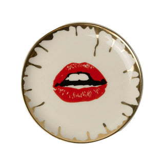 Hot Kiss Round Ceramic Trinket Dish - Holt x Palm -  Brings a pop of artful elegance to your space. Measuring 4 inches in diameter, this porcelain dish features a striking red lip motif surrounded by abstract gold accents. The luxurious design merges playful modernism with a hint of vintage allure, making it perfect for serving small bites or displaying trinkets. Crafted with food-safe materials, this dish is as functional as it is stylish€”an eye-catching statement piece for your kitchen or living space.