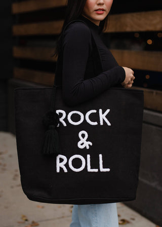 Black Rock & Roll Tote - Holt x Palm -  Get ready to rock with our super cool Black Rock & Roll Tote! Featuring punk rock vibes, this tote is perfect for those who don't take themselves too seriously. Get ready to tote around your belongings in style with this quirky and fun accessory! (Yes, we said "tote" and "rock" in the same sentence.)