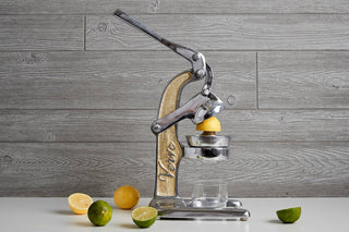 Mexican Citrus Juicer - Holt x Palm -  Have fun with friends and family as you make delicious healthy juices or exciting new and interesting cocktails. With handle up and the juicer "open" Dimensions: 12" L x 5.7" W x 18.5" H With Handle down and the juicer "closed" Dimensions: 14" L x 5.7" W x 13.5" H