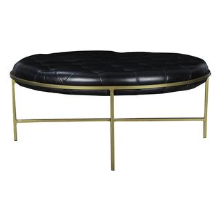 Turin Ottoman Round - Holt x Palm -  40€� dia x 17€� The combination of black leather and brass has endless appeal. Yet this bold combination can overwhelm if not balanced with lightness. The open base of the Turin Ottoman Round gives this oversized black tufted leather accent an airiness. Framed in an antique-brass finished iron, the 40-inch Turin Ottoman Round can serve as table or seat.