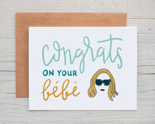 Congrats On Your Bebe - Moira Rose New Baby Card - Holt x Palm -  Congrats On Your Bebe - Moira Rose New Baby Card...OMG, who does not love Moira from Schitt's Creek and you can just hear her voice when you read this card! DESIGN: Digital art created in Procreate and designed by me :) MATERIALS: Printed on 110# white cardstock. Includes a craft paper envelope SIZE: A2, folded INSIDE: Blank inside